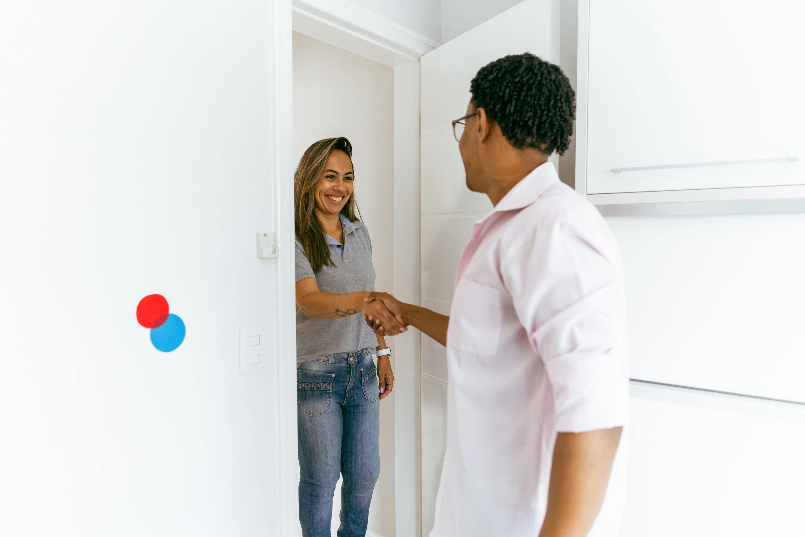 Technician and customer shaking hands after service