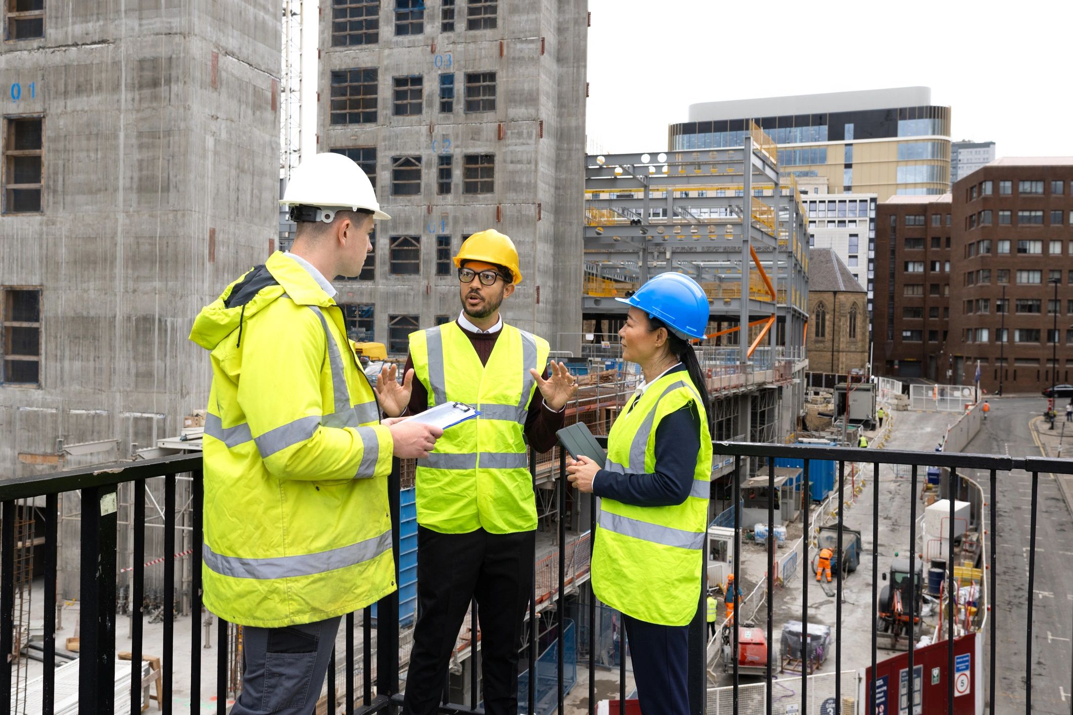 Team members reviewing plans together on a jobsite, representing coordinated project work.