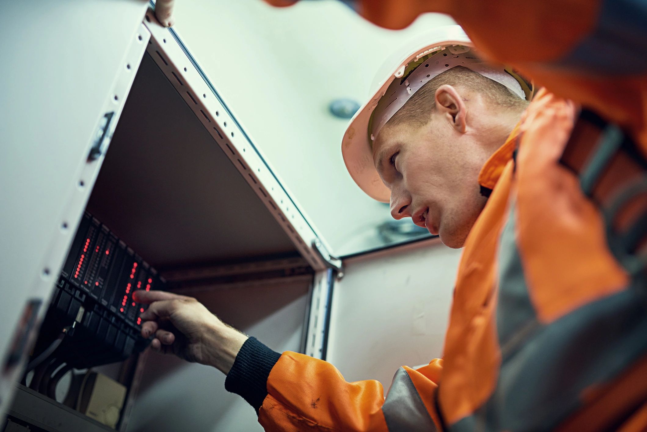 HVAC professional inspecting mechanical equipment